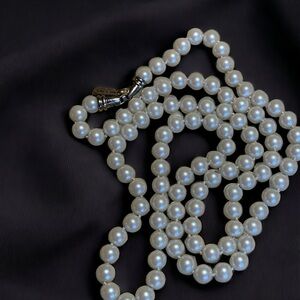 Kissaka hand knotted glass faux pearl strand.
